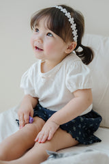 Happy Toddler Wearing Avauma Merry Purp Vanilla Cream Short Sleeve Top with Navy Shorts, Cute Baby Outfit
Happy Toddler Wearing Avauma Merry Purp Vanilla Cream Short Sleeve Top with Navy Shorts, Cute Baby Outfit