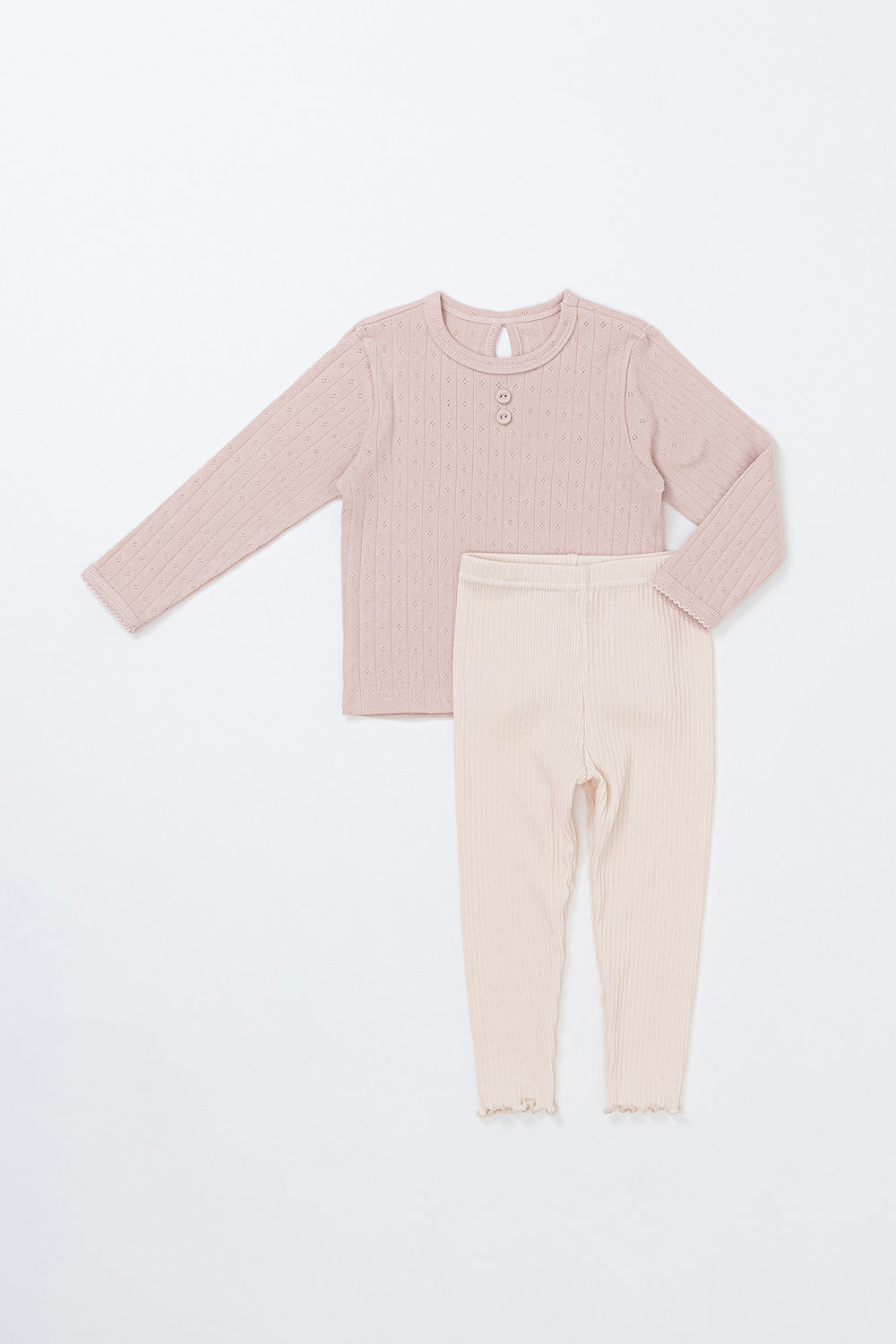 Front view of the Avauma Peach Glow Set in Pale Peach – a cute children’s outfit featuring a textured knit top and ribbed leggings Front view of the Avauma Peach Glow Set in Pale Peach – a cute children’s outfit featuring a textured knit top and ribbed leggings