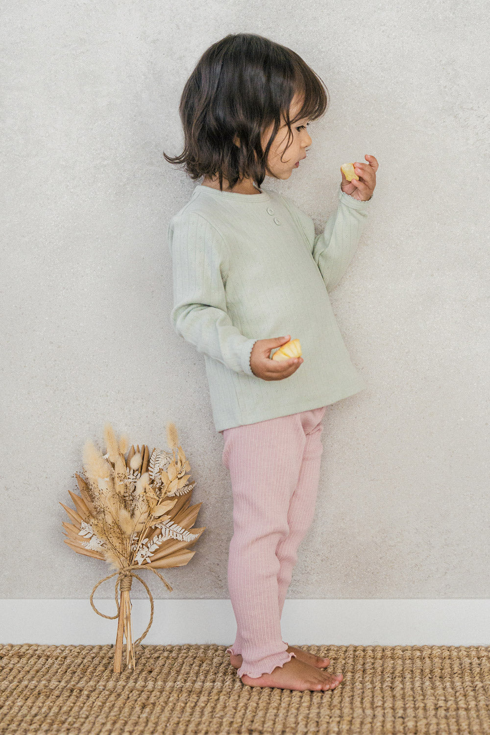 Side view of a child wearing the Avauma Peach Glow Set in Soft Sage – crafted from soft materials with a comfortable fit ideal for everyday play  Side view of a child wearing the Avauma Peach Glow Set in Soft Sage – crafted from soft materials with a comfortable fit ideal for everyday play