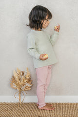 Side view of a child wearing the Avauma Peach Glow Set in Soft Sage – crafted from soft materials with a comfortable fit ideal for everyday play  Side view of a child wearing the Avauma Peach Glow Set in Soft Sage – crafted from soft materials with a comfortable fit ideal for everyday play