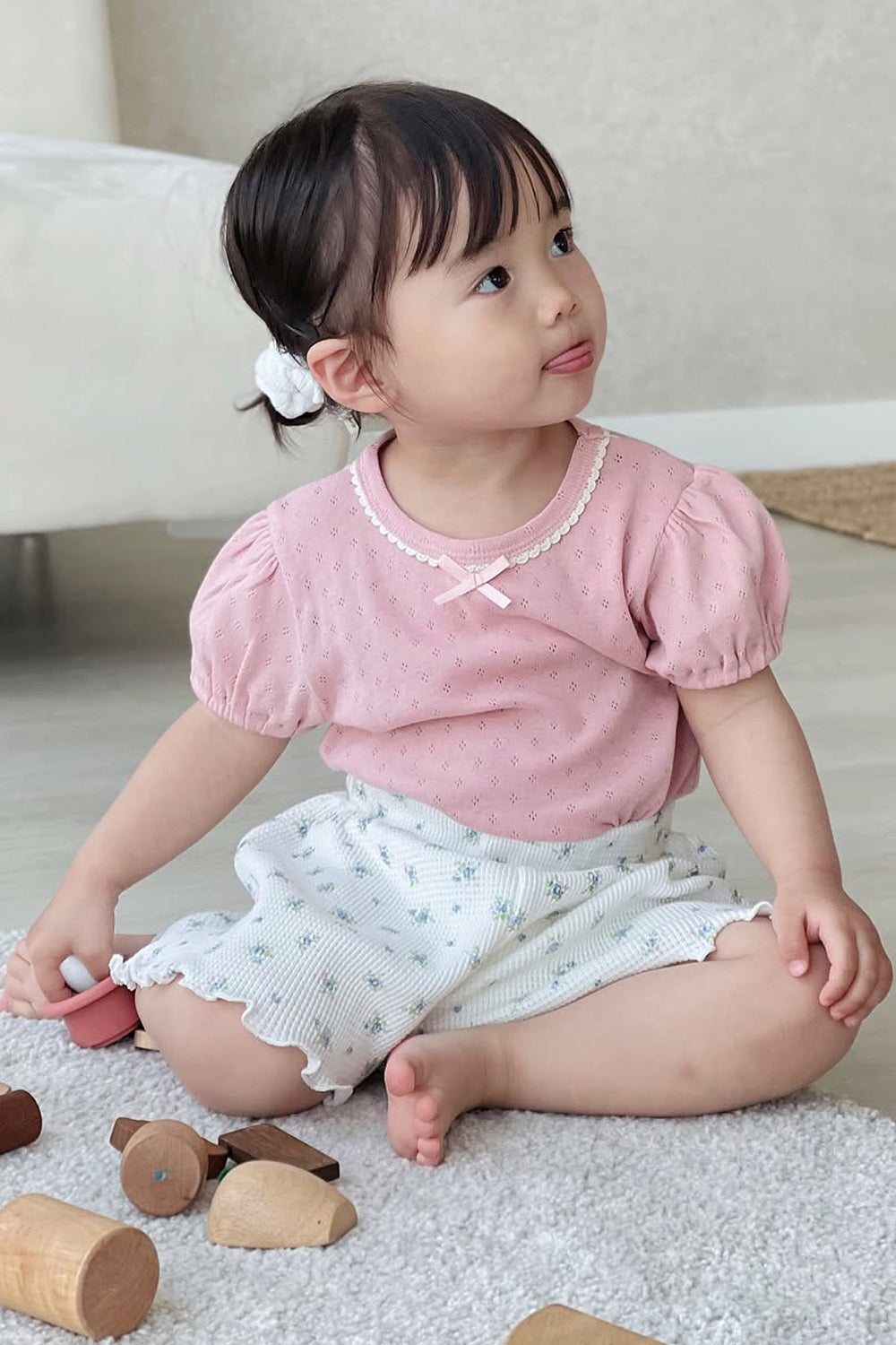 Toddler Sitting on Rug in Avauma Petit Bloom Blooming White Shorts, Floral Summer Shorts for Baby Girls
Toddler Sitting on Rug in Avauma Petit Bloom Blooming White Shorts, Floral Summer Shorts for Baby Girls