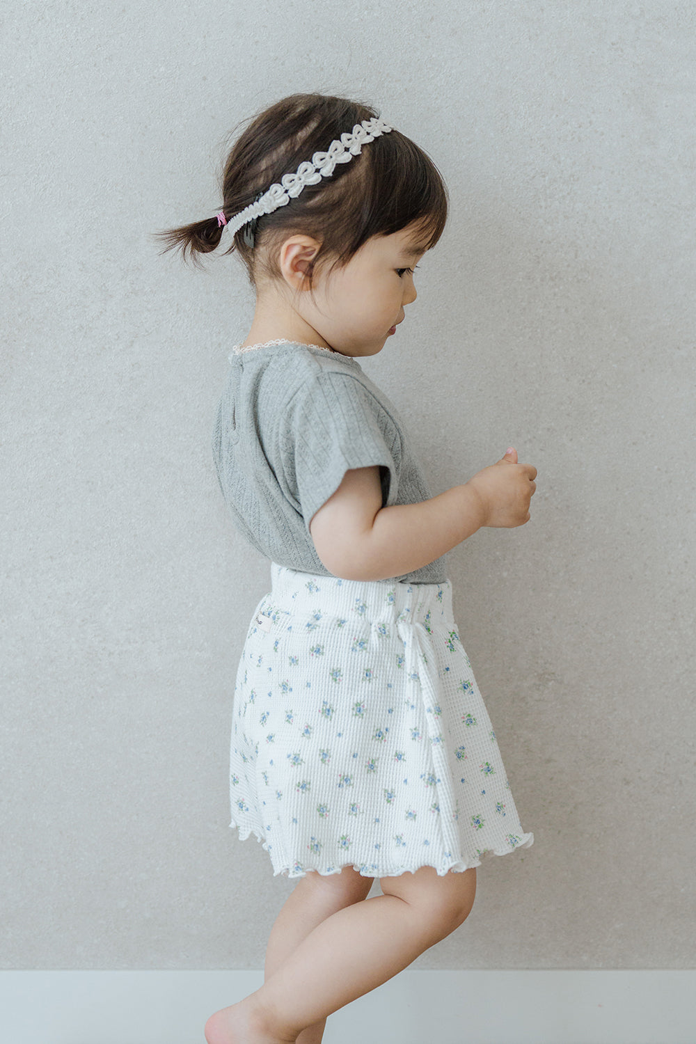 Side View of Toddler Wearing Avauma Petit Bloom Blooming White Baby Shorts, Lightweight Cotton Shorts
Side View of Toddler Wearing Avauma Petit Bloom Blooming White Baby Shorts, Lightweight Cotton Shorts