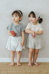 Two Toddlers Wearing Avauma Petit Bloom Blooming White Shorts, Matching Floral Baby Shorts for Summer
Two Toddlers Wearing Avauma Petit Bloom Blooming White Shorts, Matching Floral Baby Shorts for Summer