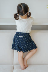 Toddler Girl Standing on Sofa in Avauma Petit Bloom Deep Blue Flower Baby Shorts, Delicate Floral Pattern for Summer
Toddler Girl Standing on Sofa in Avauma Petit Bloom Deep Blue Flower Baby Shorts, Delicate Floral Pattern for Summer