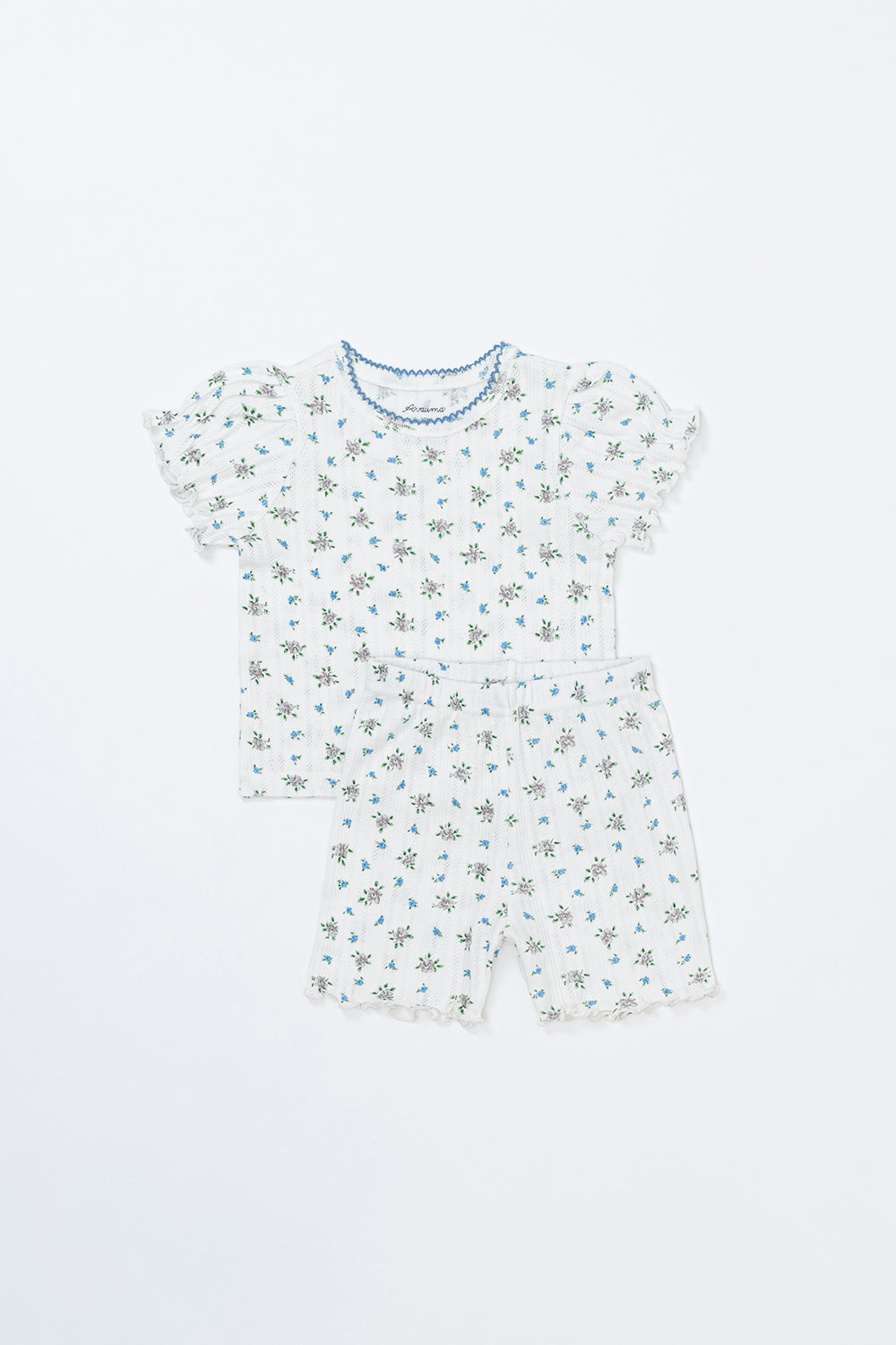 Avauma Petit Ruffle Bluebell short sleeve set, baby girl's summer outfit with bluebell floral print, ruffle sleeves, and matching shorts on white background.
Avauma Petit Ruffle Bluebell short sleeve set, baby girl's summer outfit with bluebell floral print, ruffle sleeves, and matching shorts on white background.