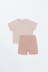 Flat lay of Pure Hug baby set in rosy blush, featuring floral ruffle sleeve top and pink ribbed shorts. Flat lay of Pure Hug baby set in rosy blush, featuring floral ruffle sleeve top and pink ribbed shorts.