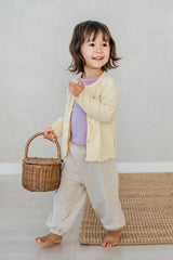 Avauma butter yellow ribbed baby cardigan, lightweight toddler sweater styled with lavender tee and jogger pants Avauma butter yellow ribbed baby cardigan, lightweight toddler sweater styled with lavender tee and jogger pants