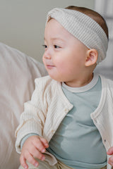 Avauma baby girl in off white cardigan, soft knit texture and gentle frill sleeves Avauma baby girl in off white cardigan, soft knit texture and gentle frill sleeves