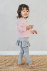 Side view of toddler wearing Avauma silver misk skirted leggings while walking โ soft and flexible baby pants Side view of toddler wearing Avauma silver misk skirted leggings while walking โ soft and flexible baby pants