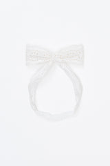 Avauma Rumiere Ribbon Band - Cotton Cream laid flat on a white background, showing full lace bow Avauma Rumiere Ribbon Band - Cotton Cream laid flat on a white background, showing full lace bow