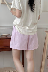 Back view of Avauma Sunny Stripe mom shorts in lotus pink with relaxed fit.
Back view of Avauma Sunny Stripe mom shorts in lotus pink with relaxed fit.