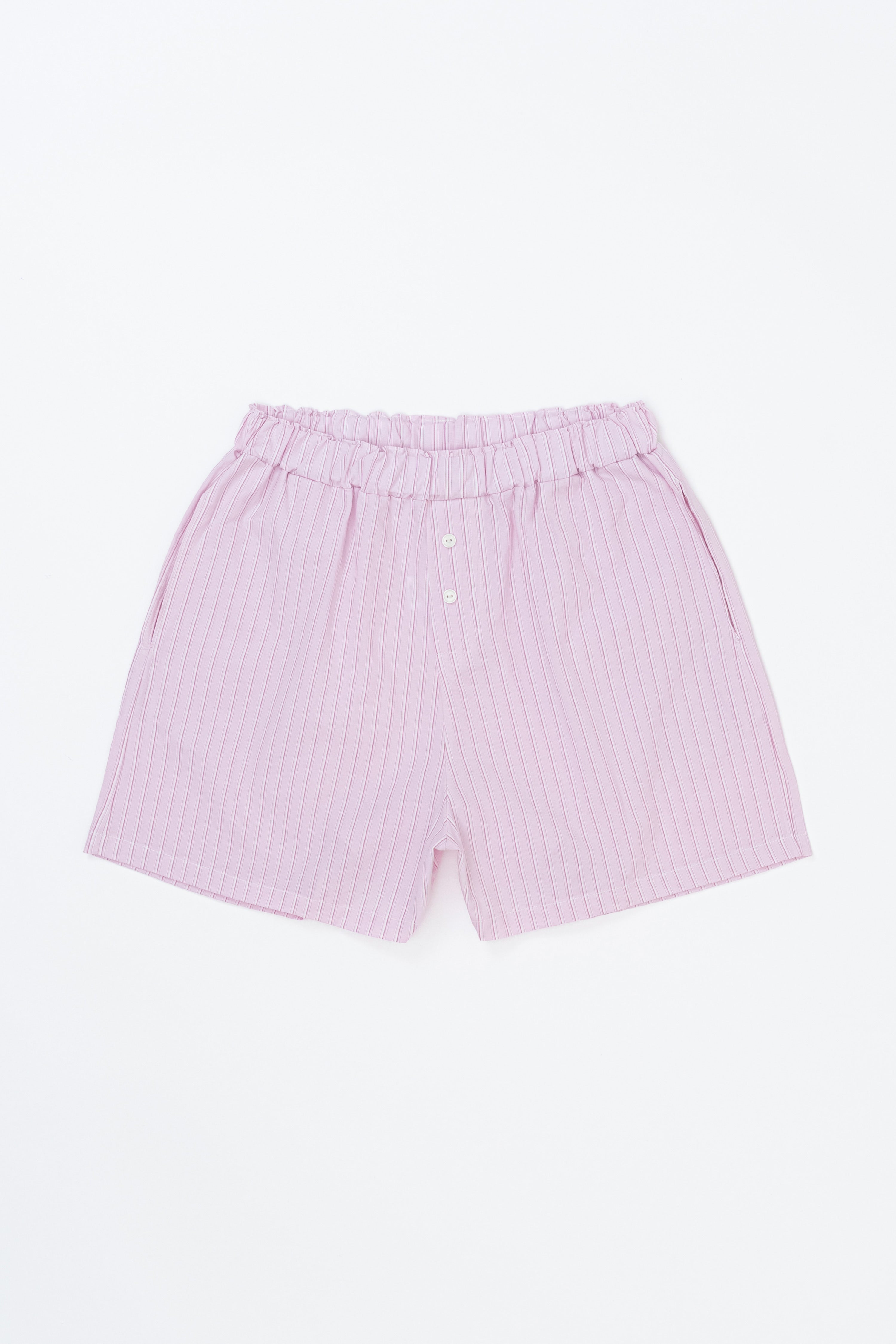 Avauma Sunny Stripe mom pants in lotus pink laid flat, showing soft cotton texture.
Avauma Sunny Stripe mom pants in lotus pink laid flat, showing soft cotton texture.