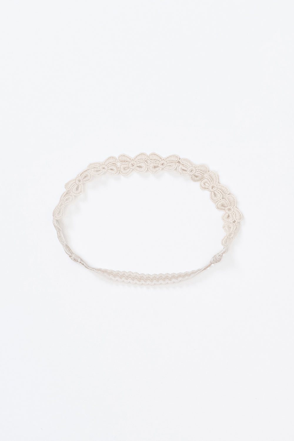 Avauma White Garden Band headband in Cream Beige with delicate bow embroidery, displayed flat on white background Avauma White Garden Band headband in Cream Beige with delicate bow embroidery, displayed flat on white background
