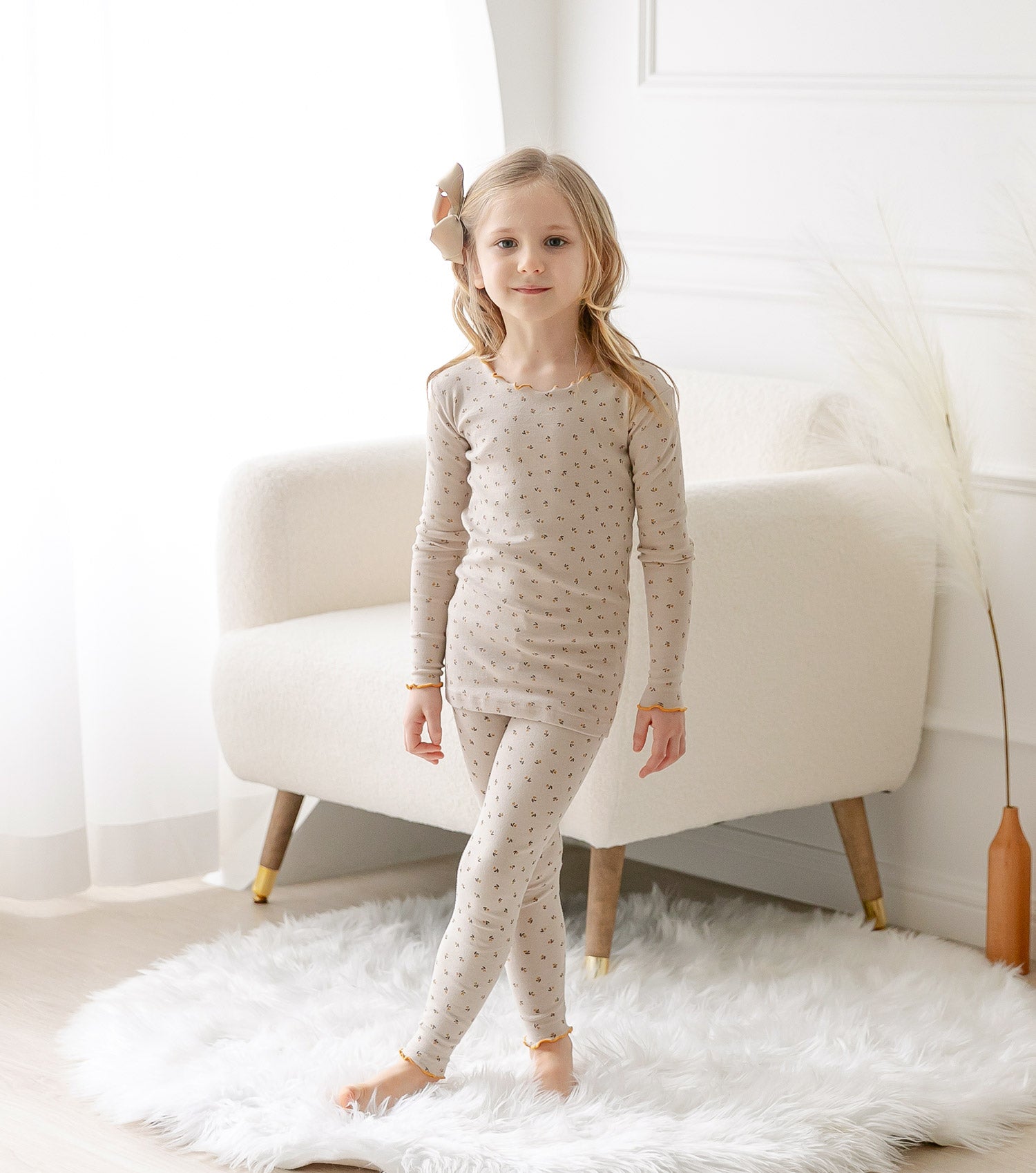 AVAUMA Liang Long Sleeve Set Beige Ruffle Shirring These pajamas have a stylish 'Ruffle Shirring' design and are soft, stretchy, and comfortable.