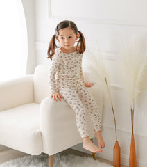 AVAUMA Laura Long Sleeve Set Beige Ruffle Shirring These pajamas have a stylish 'Ruffle Shirring' design and are soft, stretchy, and comfortable.