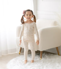 AVAUMA Bling Long Sleeve Set Ivory Ruffle Shirring These pajamas have a stylish 'Ruffle Shirring' design and are soft, stretchy, and comfortable.