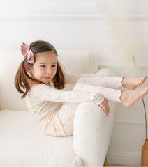 AVAUMA Bling Long Sleeve Set Ivory Ruffle Shirring These pajamas have a stylish 'Ruffle Shirring' design and are soft, stretchy, and comfortable.