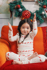 Kids enjoying Christmas decorations while wearing AVAUMA Holiday Long Sleeve Pajama Set - Little Reindeer