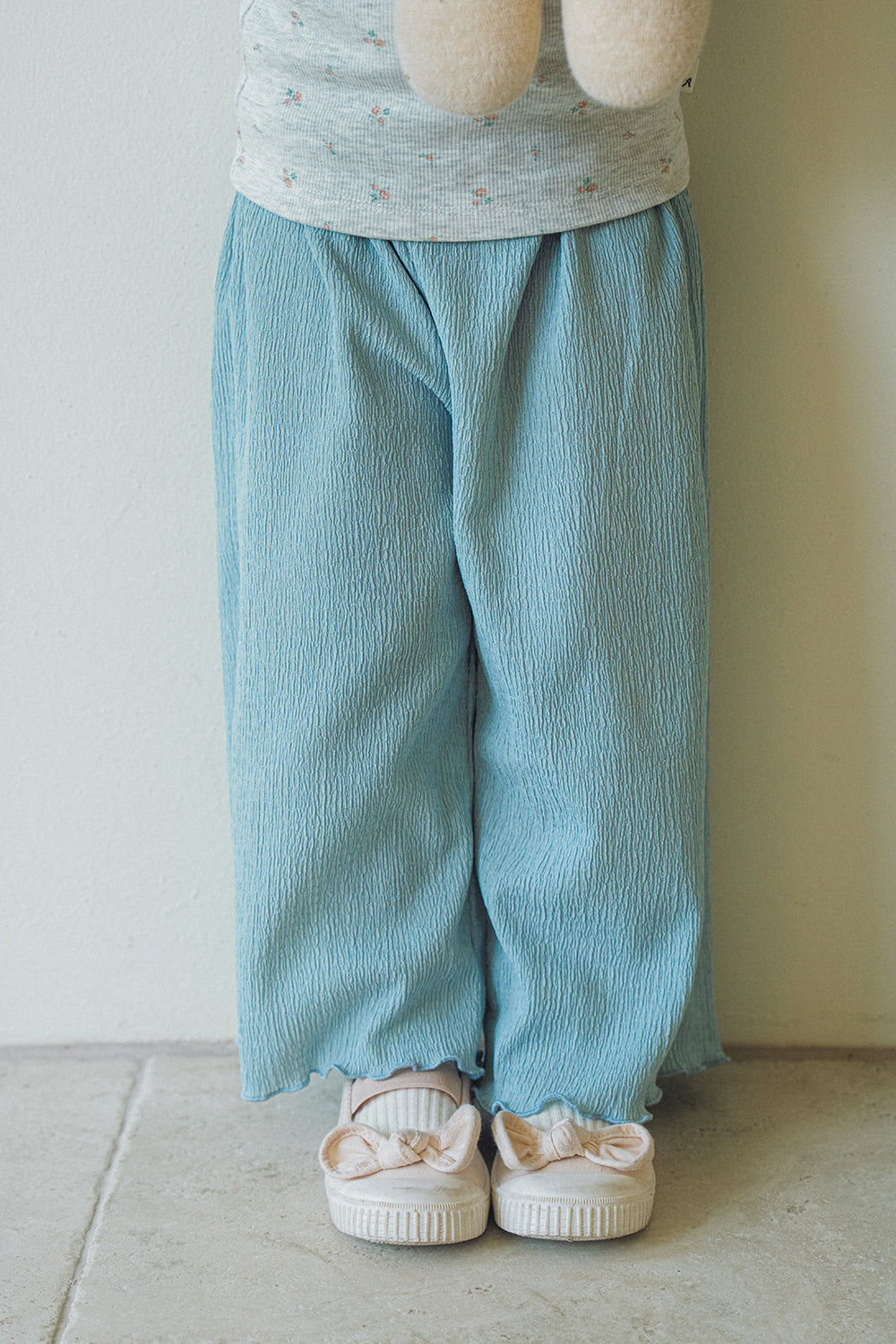 Close-up of Avauma Sky Blue pleated toddler pants and hem detail