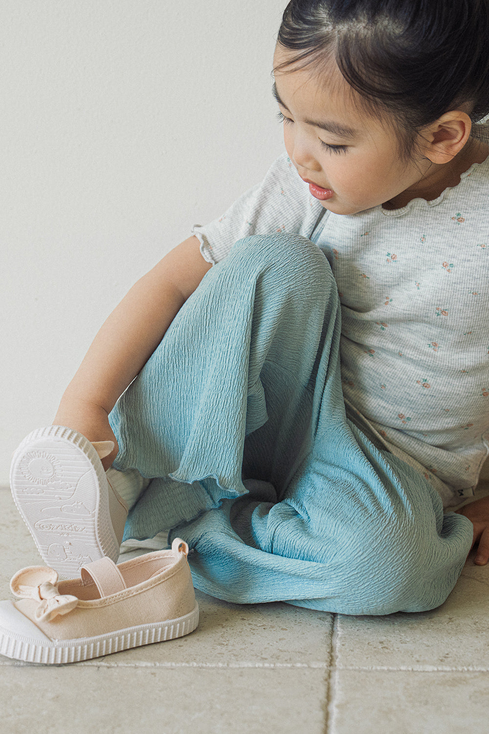 Close-up of Avauma Sky Blue lightweight pleated pants for toddlers