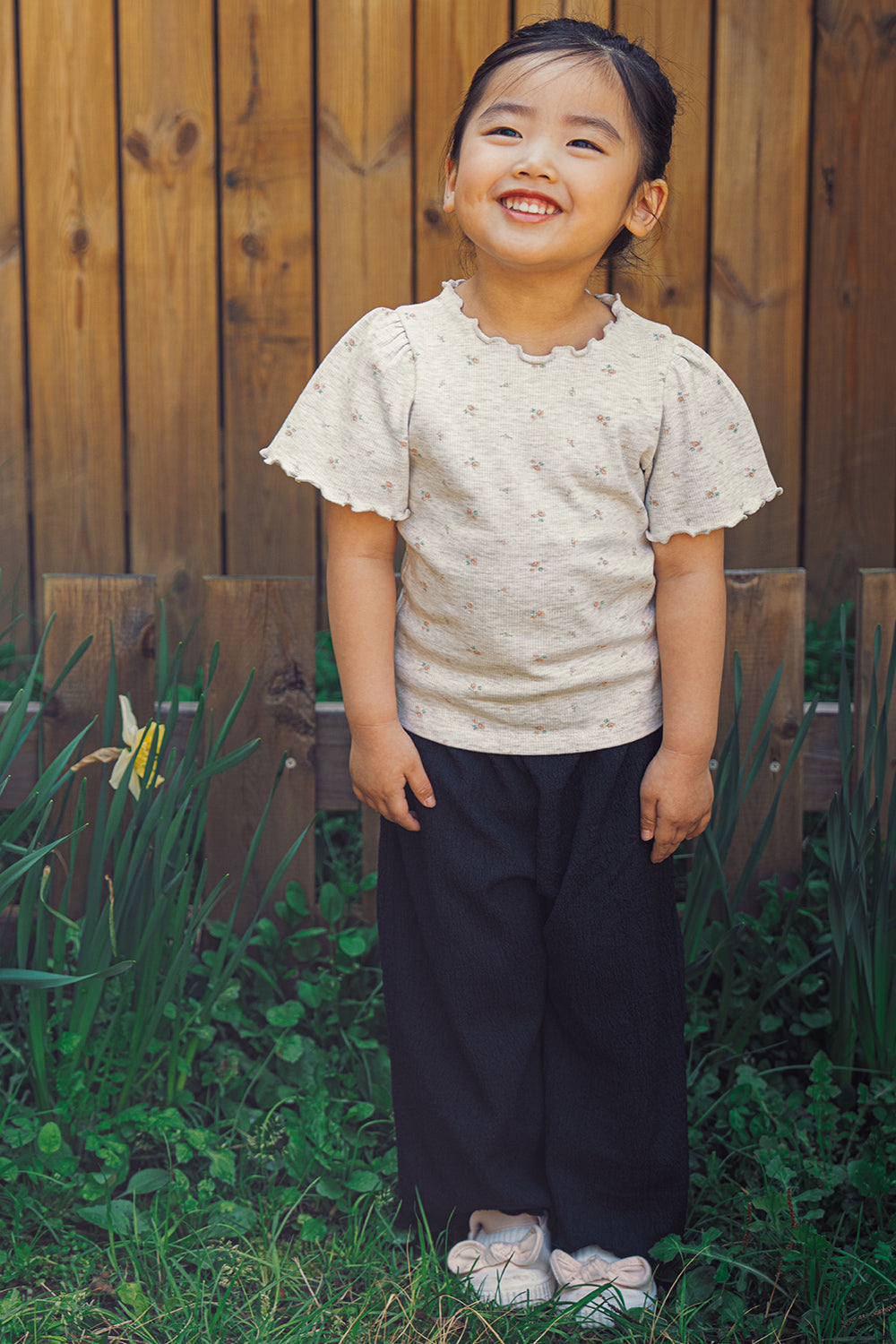 Toddler girl wearing Avauma Soft Black wide-leg pleats pants