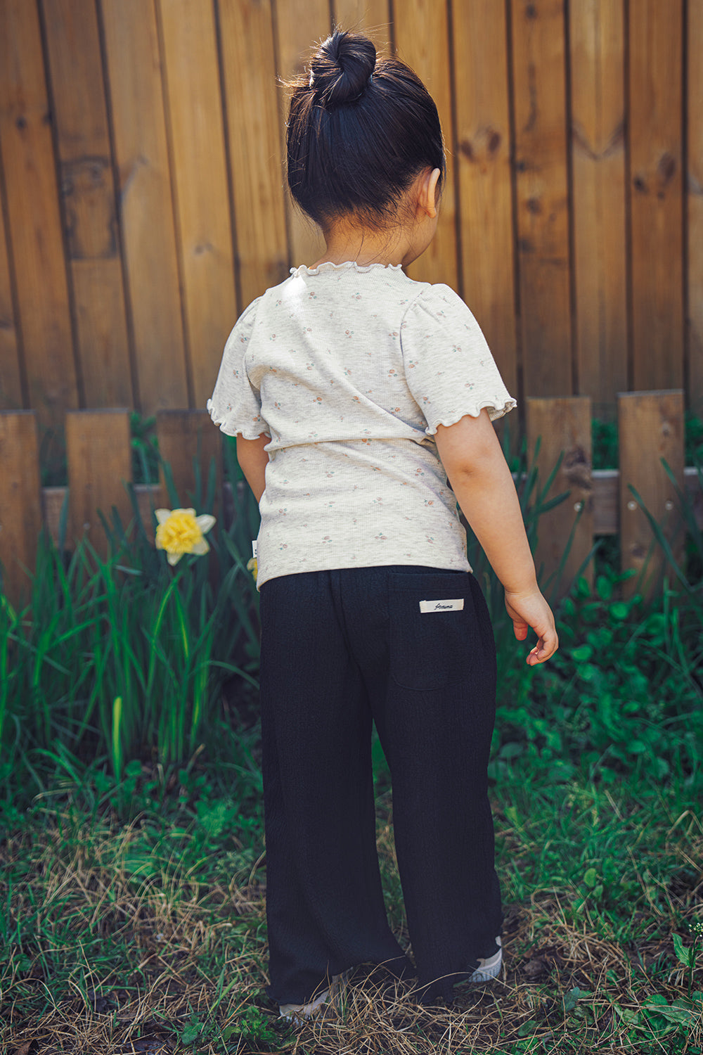 Back view of Avauma Soft Black pleated summer pants for toddlers