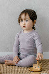 Toddler sitting in Avauma Pogny Long Sleeve Set in Blueberry Yogurt color, soft cotton sleepwear, perfect for all-day comfort and play