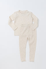 Avauma Eyelet Bloom Long Sleeve Setup Pajamas - Creamy Flower, featuring a delicate floral print on a soft cream-colored top and bottom set, perfect for cozy baby sleepwear.