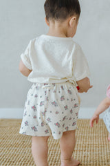 Back View of Avauma Fluffy Garden Cream Rose Shorts on Baby, Relaxed Fit Cotton Baby Shorts


