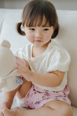 Toddler Sitting in Avauma Fluffy Garden Peach Mood Baby Shorts, Breathable and Comfy Summer Outfit

