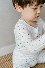 Avauma Mini Fleur Long Sleeve Set - Frill Blooming, featuring a white pajama set with blue floral print and delicate frill details, perfect for baby sleepwear.