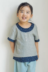 Toddler girl wearing Avauma Melange Navy floral layered summer tee