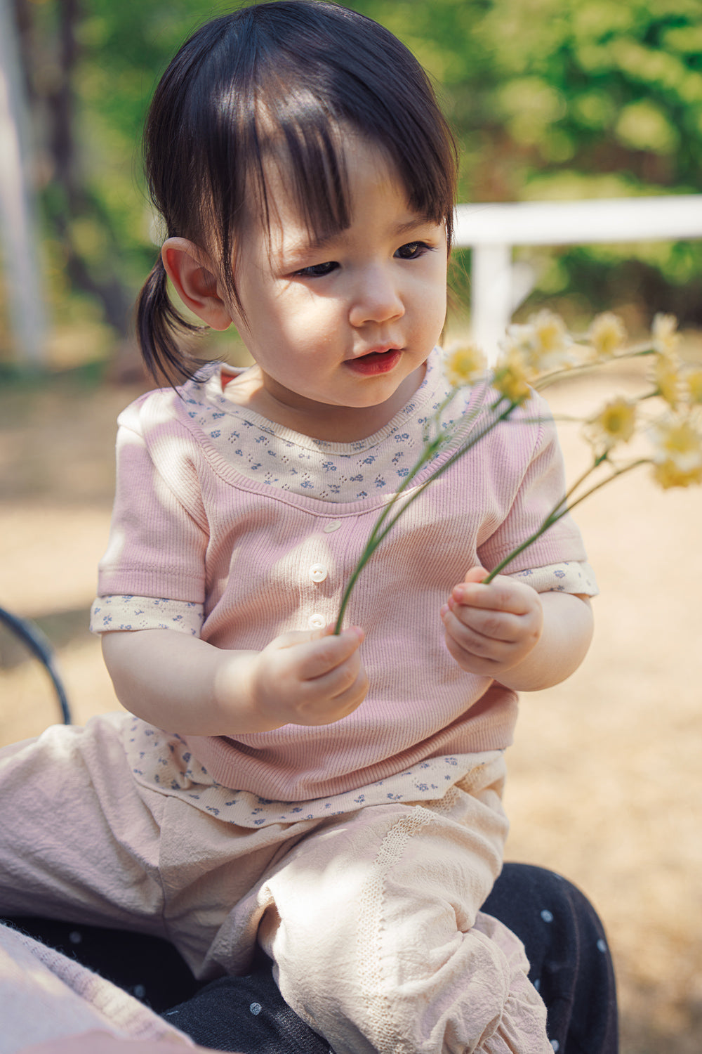 Close-up of Avauma Pink Ivory ribbed floral tee for toddlers
