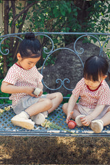 Two toddler girls matching in AVAUMA summer shorts sets for boutique kids wear