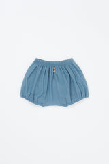 Avauma Linen Bloomer Sky product shot. Light blue baby bloomers with elastic waist and two wooden buttons on a white background.

