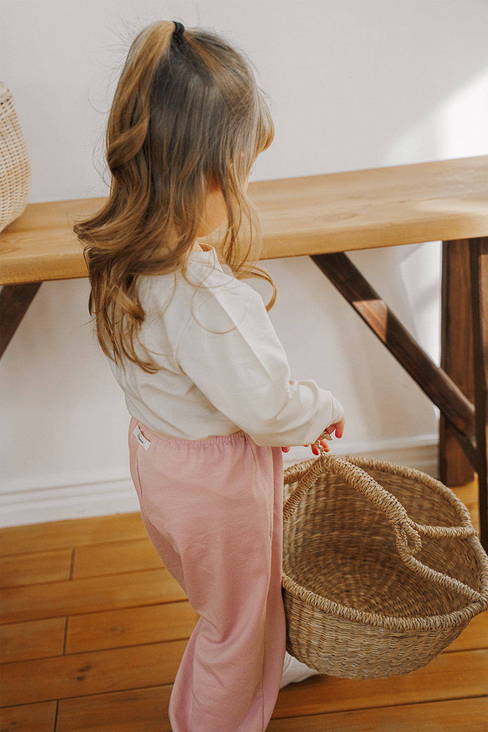 avauma toddler daily wear outfit in soft pink jogger pants, indoor lifestyle
