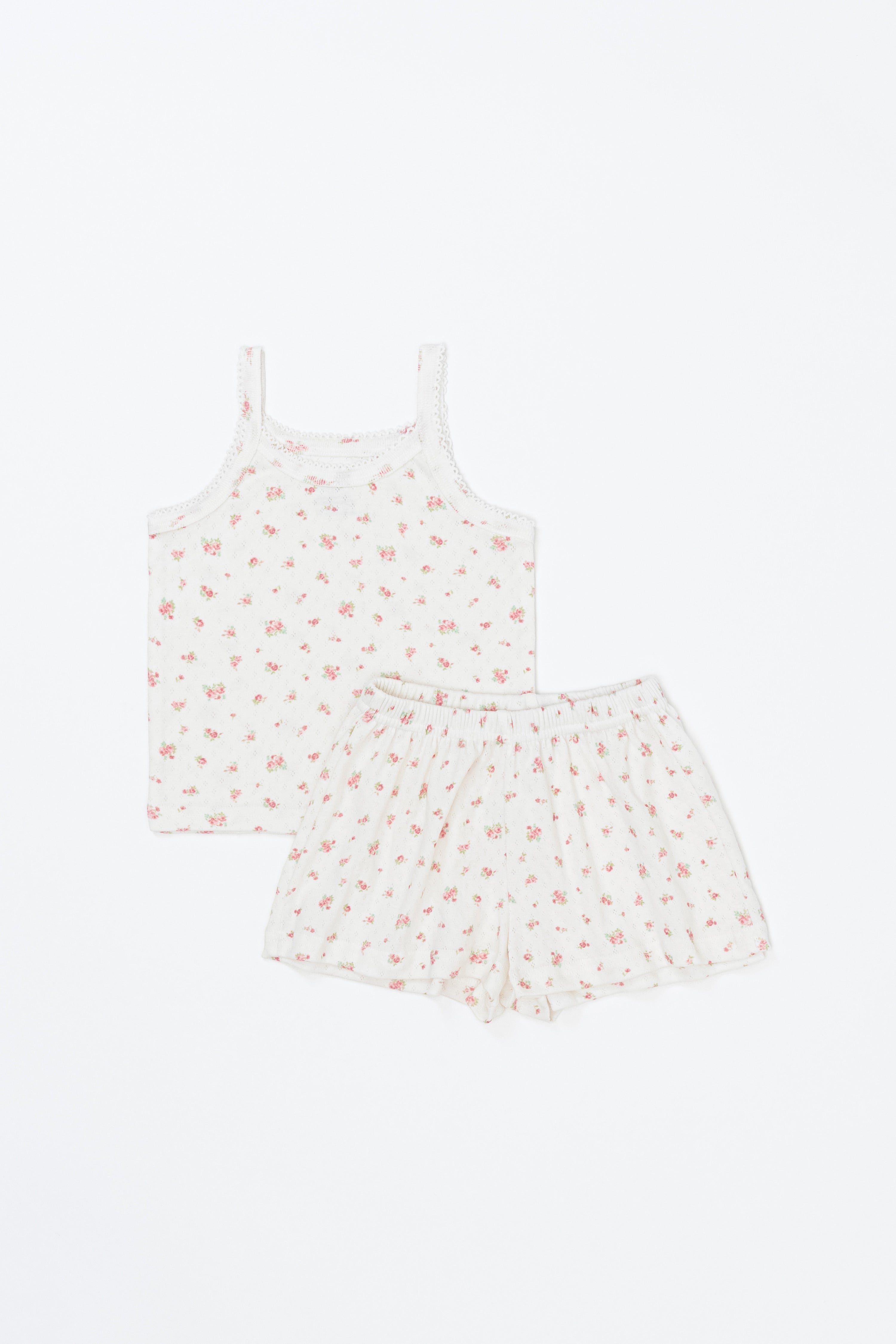 Flatlay of Avauma rose belle picnic tank top and frill shorts – soft floral print