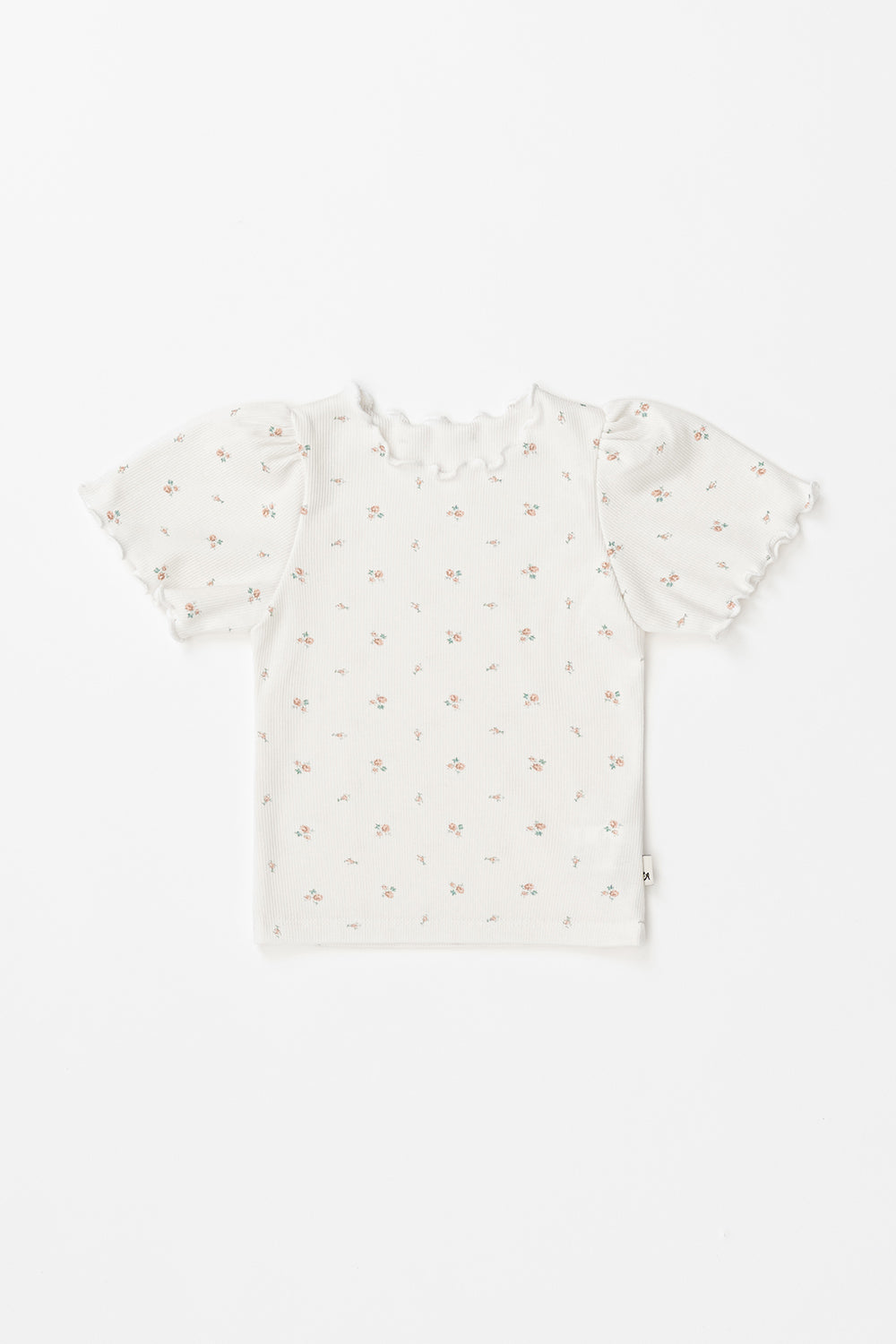 Avauma short-sleeve baby girl floral t-shirt in cream with ruffled hems, flat lay view.