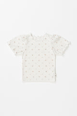 Avauma short-sleeve baby girl floral t-shirt in cream with ruffled hems, flat lay view.