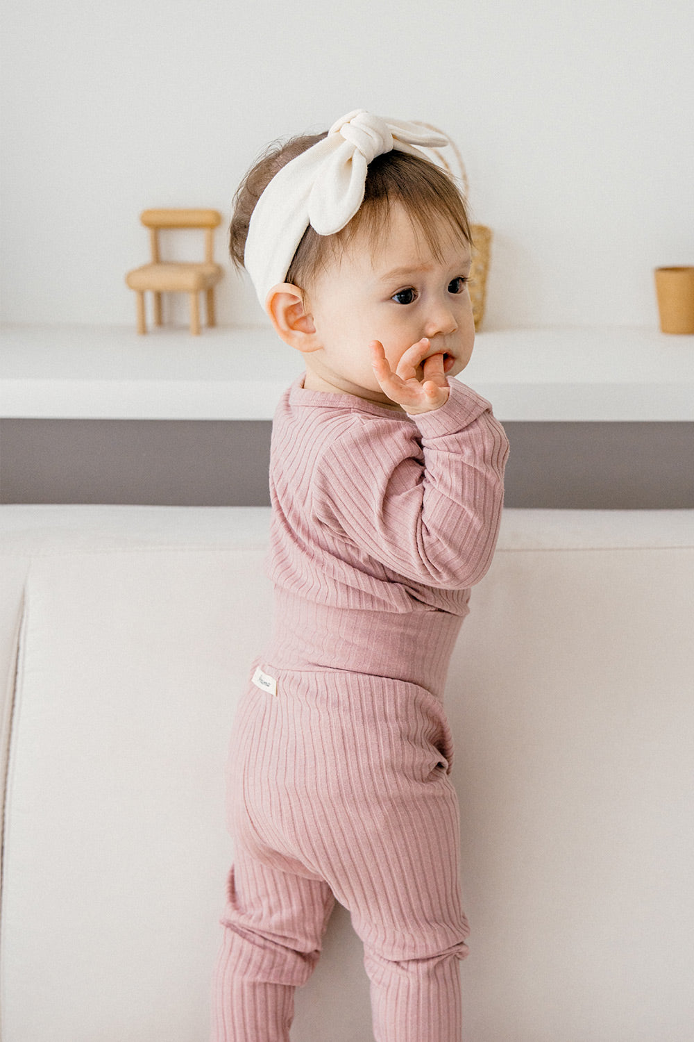 Baby boy in soft baby pajamas set in Berry Berry Strawberry color, cozy ribbed fabric made from cotton and modal for comfortable sleep and play, ideal baby sleepwear.