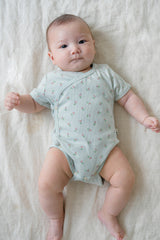 Baby Lying Down in Avauma Clare Mint Rose Short Sleeve Bodysuit, Comfortable and Breathable Summer Outfit

