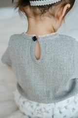 Back Detail of Avauma Le Petite Soft Gray Puff Sleeve Knit Top with Keyhole Button Design

