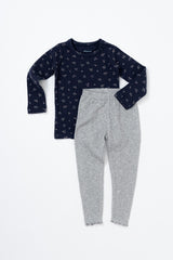 Baby wearing Avauma Picot Flower Setup - Lunabel Gray pajama set, featuring a navy floral-patterned top and light gray ribbed pants, ideal sleepwear for babies.