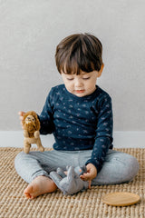 Another view of a toddler playing in Avauma Picot Flower Setup - Lunabel Gray, a comfortable and stylish sleepwear choice for babies and toddlers.