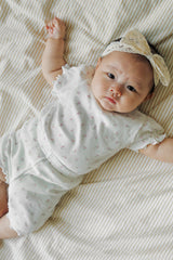 Avauma baby girl floral pajama set soft lavender lying down outfit
