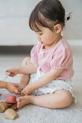 Toddler Playing Comfortably Wearing Avauma Merry Purp Cotton Pink, Cozy Kids Clothing Set

