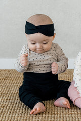 Toddler standing in Avauma Lovely Duet Setup - Mini Heart Pale Black, wearing a cute and comfortable sleepwear set, perfect for play and bedtime.