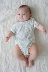 Baby Lying Down in Avauma Petite Garden Mintgarden Short Sleeve Bodysuit, Comfortable Summer Babywear

