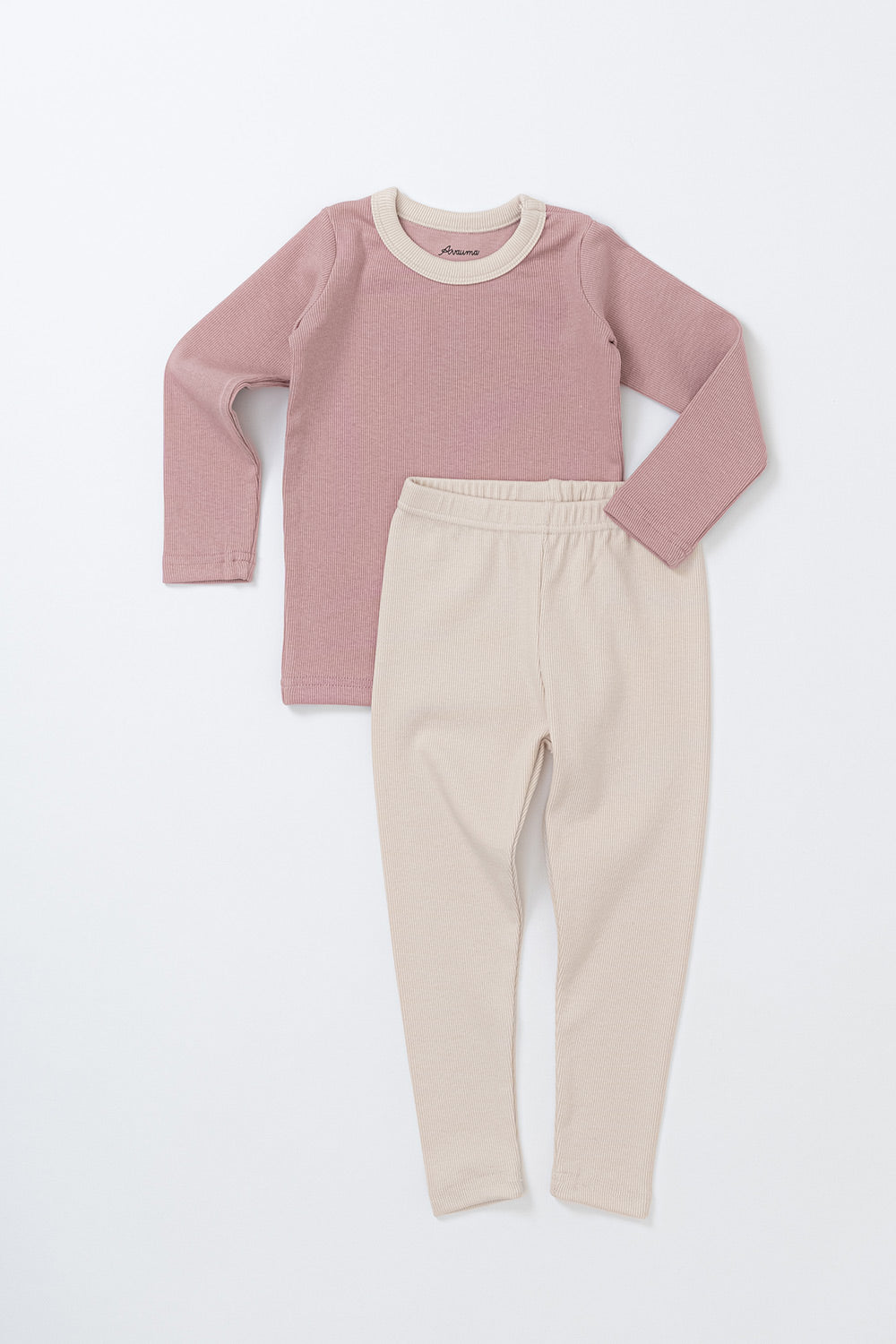 Flat lay of Avauma's Coco Classic Long Sleeve Set in Strawberry Cheese color - featuring a soft pink top and cream pants, designed for baby sleepwear and loungewear.