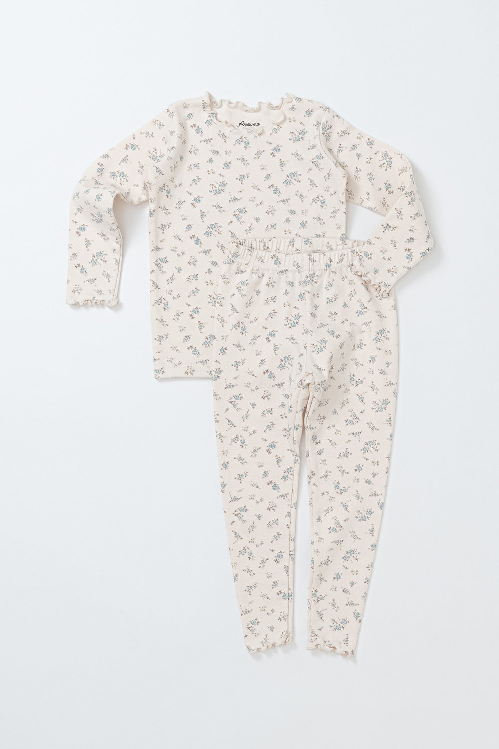 Avauma Fluid Blossom Long Sleeve Set - Vanilla Flower, featuring a cream pajama set with yellow floral prints and frill details, perfect for baby girls' comfortable sleepwear.